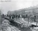  ??  ?? German soldiers walking freely out of the trenches on Christmas Day 1914