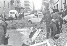  ?? ?? In this file photo taken on Dec 20, 1973 policemen search among the damages caused by a bomb attack, claimed by the Basque separatist movement ETA, in which Prime Minister Luis Carrero Blanco has been killed.