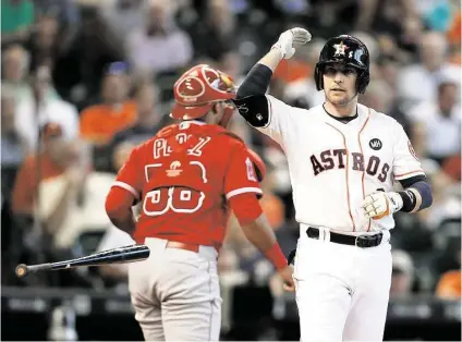  ?? Karen Warren / Houston Chronicle ?? This strikeout in the third inning typified Jed Lowrie’s 0-for-5 day at the plate Wednesday. He also made the game-ending out. The Astros stranded eight runners one day after leaving 11 on base, resulting in two critical losses to the fast-closing...