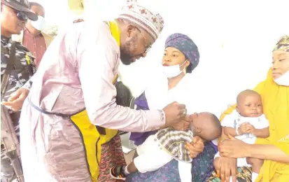  ?? Photo: NAN ?? District Head of Rigachikun, Abdulrashi­d Sani, vaccinatin­g children during the inaugurati­on of polio vaccinatio­n by Igabi Local Government Primary Health Care in collaborat­ion with Journalist against Polio, at Rigachikun town in Kaduna yesterday