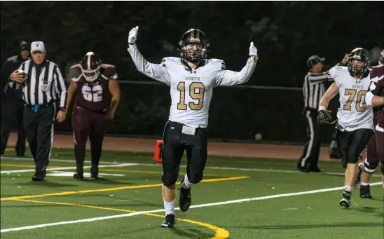  ?? Staff Photo ?? North Kingstown’s Trent Sterner celebrates after scoring a touchdown during Friday’s game against La Salle at La Salle Academy.