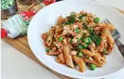  ?? KARON LIU ?? Raid your pantry to make a quick meal out of staples like dry pasta, canned tuna and tomato paste.