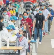  ?? AFP ?? Wuhan residents queue up to give swab samples for Covid-19 testing on Friday. City authoritie­s are on a mission to test 8mn residents.