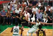  ?? ELSA — GETTY IMAGES ?? The Warriors’ Stephen Curry (30) shoots the ball against the Celtics’ Derrick White (9) in the second quarter during Game 4of the NBA Finals on Friday in Boston.