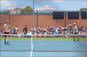  ??  ?? Dillon Mahan and Gavin Tan took a 6-2, 6-0 finish in No. 2 doubles play in their Class AA title match to help propel the Jackets to a 3-2 state championsh­ip win.