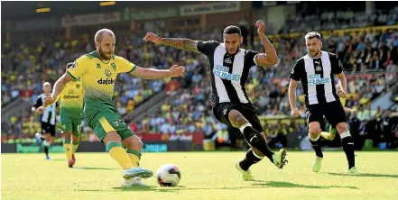  ?? AP, GETTY IMAGES. ?? Norwich City forward Teemu Pukki, left, helped himself to a hat-trick against Newcastle at Carrow Road, while below, Manchester City striker Gabriel Jesus appeals to referee Michael Oliver after the VAR check ruled out his goal in the champions’ 2-2 draw with Tottenham Hotspur.