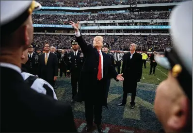  ?? The New York Times/TOM BRENNER ?? President Donald Trump conducts the coin toss Saturday for the Army-Navy football game in Philadelph­ia after telling reporters as he left the White House that John Kelly was stepping down as his chief of staff.