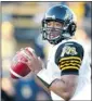  ?? Fred Thornhill, Reuters ?? Hamilton Tiger-Cats pivot Henry Burris looks for an opening against Toronto in pre-season last week.