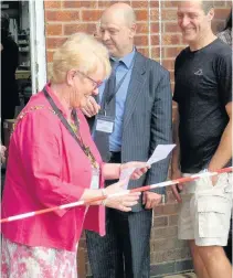  ??  ?? Pictured is the Mayor of Charnwood, Coun Pauline Ranson, cutting the ribbon and opening the new garden area.