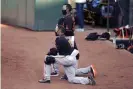  ?? Photograph: Ben Margot/AP ?? Gabe Kapler kneels before Monday’s game: ‘I wanted to demonstrat­e my dissatisfa­ction with our clear systemic racism in our country’.