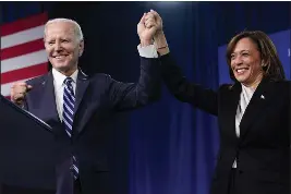  ?? PATRICK SEMANSKY — THE ASSOCIATED PRESS ?? President Joe Biden and Vice President Kamala Harris stand on stage at the Democratic National Committee winter meeting on Friday in Philadelph­ia. A majority of Democrats now think one term is plenty for Biden, despite his insistence that he plans to seek reelection in 2024. That's according to a new poll from The Associated Press-NORC Center for Public Affairs Research.