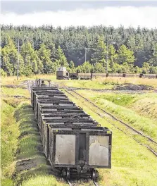  ?? PHOTO: EAMONN FARRELL PHOTO: GERRY MOONEY ?? Peat industry: Bord na Móna carriages. Main: Finance Miniser Paschal Donohoe reading Budget 2020 in his department office.