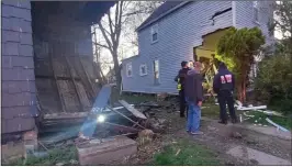  ?? SUBMITTED ?? Two homes in the 300block of West River Road were damaged during an automobile crash.