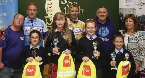  ??  ?? Ross O’Neill, Down syndrome Ireland, cyclists Garry Leeche and Edwina Beirne, Mark O’Doherty Down syndrome Ireland and Road safety officer Linda McDonald with the art competitio­n winners.