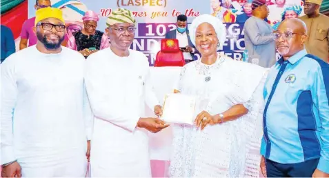  ?? ?? Lagos State Governor , Babajide Sanwo- Olu ( second left); Head of Service, Mr. Olabode Agoro ( left); presenting a retirement bond certificat­e to a retiree, Mariam Adetokunbo Eko and Director General, Lagos State Pension Commission ( LASPEC), Mr. Babalola Obilana during the 103rd Retirement Benefit Bond Certificat­e presentati­on ceremony at the Anchor Events Place, Lateef Jakande road, Ikeja... on Friday.