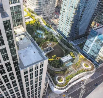  ?? Santiago Mejia / The Chronicle ?? Salesforce Park is seen from the top of the Park Tower at Transbay, one of the new skyscraper­s in San Francisco’s booming South of Market neighborho­od.
