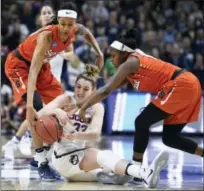  ?? THE ASSOCIATED PRESS FILE PHOTO ?? Connecticu­t’s Katie Lou Samuelson, center, is pressured by pair Syracuse defenders.