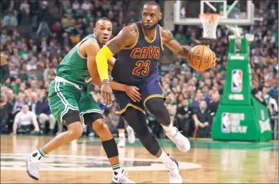  ?? DAVID BUTLER II / USA TODAY SPORTS ?? Cleveland Cavaliers forward LeBron James drives past Boston Celtics guard Avery Bradley in the first quarter of Wednesday’s NBA clash at TD Garden in Boston. Cleveland won 114-91.