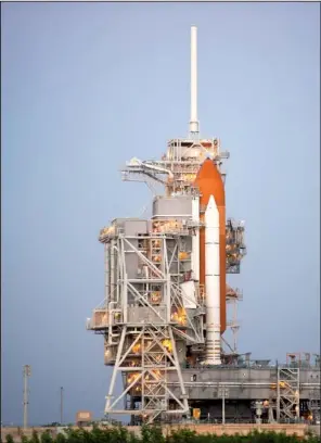  ?? NASA/BILL INGALLS ?? The space shuttle Discovery stands on Launch Pad 39A at the NASA Kennedy Space Center in Cape Canaveral, Fla., in 2010. One expert says the launchpad may not attract much investor interest.