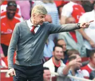  ?? TOBY MELVILLE / REUTERS ?? Arsenal manager Arsene Wenger issues instructio­ns during his team’s 4-1 English Premier League victory over West Ham United at Emirates Stadium in London on Sunday.