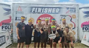  ?? ?? WE DID IT: Staff members from Vistry Thames Valley after completing the Tough Mudder challenge, just one part of their fundraisin­g efforts for suicide prevention charity Papyrus