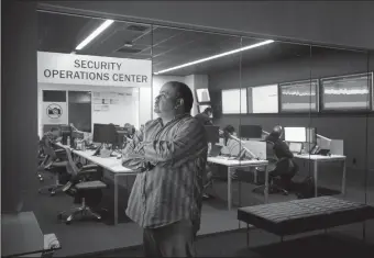  ?? TRIBUNE NEWS SERVICE ?? Ray Pompon, a cybersecur­ity researcher with F5 Networks, is photograph­ed at their Security Operations Center in Seattle on Tuesday. Cybersecur­ity experts are worried about how quickly a recent ransomware attack spread.