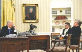  ?? ASSOCIATED PRESS FILE PHOTO ?? President Donald Trump speaks on the phone with Prime Minister of Australia Malcolm Turnbull, with then-National Security Adviser Michael Flynn, center, and thenchief strategist Steve Bannon in the Oval Office of the White House in Washington last...