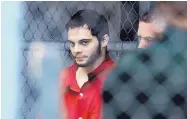  ?? AMY BETH BENNETT/SOUTH FLORIDA SUN-SENTINEL ?? Esteban Santiago is taken from the Broward County main jail as he is taken to the federal courthouse in Fort Lauderdale, Fla., on Monday.