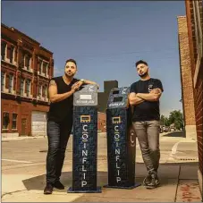  ?? Contribute­d by CoinFlip Inc. / www.jboehmphot­o.com ?? Two executives, Daniel Polotsky and Ben Weiss, from crypto-ATM company CoinFlip pose next to their company's machines.