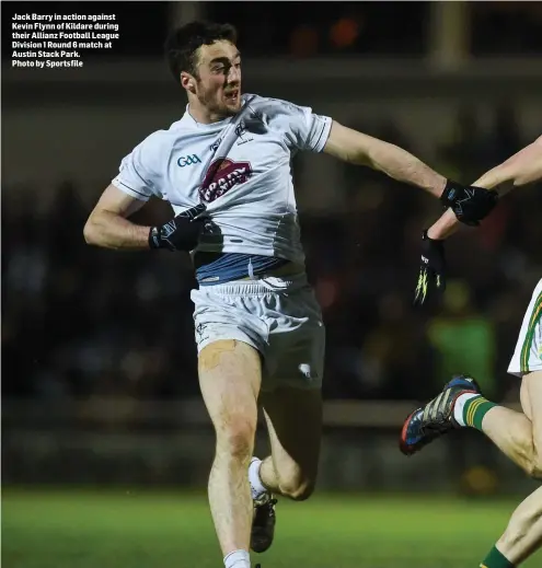  ??  ?? Jack Barry in action against Kevin Flynn of Kildare during their Allianz Football League Division 1 Round 6 match at Austin Stack Park. Photo by Sportsfile