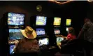  ?? Photograph: Tracey Nearmy/ ?? Punters play poker machines in Tamworth, NSW.