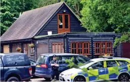  ??  ?? Murder inquiry: Police at Palmer’s sprawling Essex home