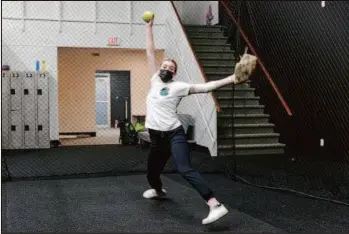  ?? CITIZEN PHOTO BY JAMES DOYLE ?? Corina McClure goes through her windup while pitching in the cage at Northern Baseball Academy on Nicholson Street.