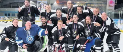  ??  ?? The Earle Road Elks celebrate their success in the ice hockey tournament held in Widnes.