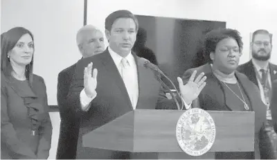  ?? CARLINE JEAN/SOUTH FLORIDA SUN SENTINEL ?? Gov. Ron DeSantis speaks at the Florida Department of Health in Miami after Florida had two confirmed cases of coronaviru­s.