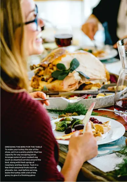  ??  ?? DRESSING THE BIRD FOR THE TABLE To make your turkey the star of the show, set it on a pretty platter that has capacity for any escaping juices. Arrange some of your cooked veg (such as steamed carrots) around the bird, along with fresh sprigs of...