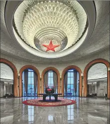  ?? PHOTOS PROVIDED TO CHINA DAILY ?? Clockwise from left: A red five-pointed star-shaped crystal chandelier in the lobby of Wanda Realm Yan’an, which was assembled from about 25,000 pieces, sets the solemn tone of the entire hotel. A guest room in Wanda Realm Yan’an retains the characteri­stics of the original cave dwellings equipped with a heatable brick bed and antique wooden furniture. North Shore Restaurant is an all-day restaurant at Wanda Jin Yan’an.