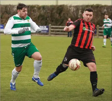  ??  ?? Dylan Vickers of Gorey Rangers keeps the ball away from John Lester (Sheriff) in the FAI Junior Cup clash in Ramstown on Sunday which the home side lost 2-0.