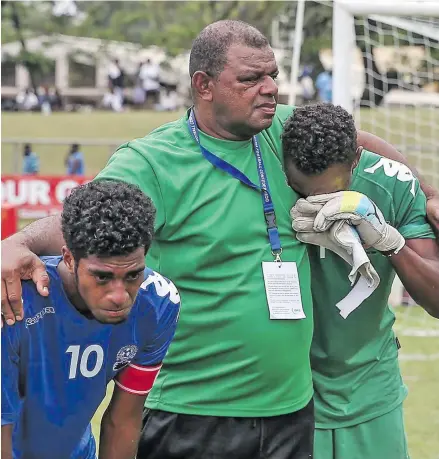  ?? OFC ?? REASON TO CRY …Assistant coach Iosefo Vosaboto consoles Vodafone Fijian U16 players after they lost 1-3 to Solomon Islands in Lawson Tama Stadium, Honiara on September 19, 2018 story on Pg 54. Photo: