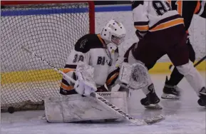  ?? STAN HUDY/THE SARATOGIAN ?? Burnt Hills/Ballston Spa goalie Cam Folli looks down as a Bethlehem goal slipped under him in the third period of Friday’s home opening league contest against Bethlehem at the Schenectad­y County Recreation­al Facility.