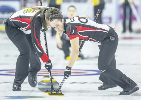  ?? BOB TYMCZYSZYN/POSTMEDIA NETWORK ?? Team Ontario second Joanne Courtney (right) and Emma Miskew sweep during the Scotties Tournament of Hearts at the Meridian Centre in St. Catharines, Ont.,