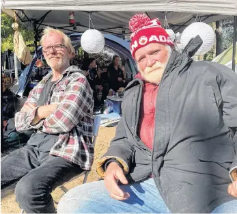  ?? ANDREW RANKIN • SALTWIRE NETWORK ?? Ross Robicheau, 62, left, and Wayne Moulton, 65, have been living in tents at the Meagher Park homeless encampment in Halifax for the past two months.