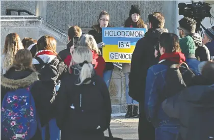  ?? ED KAISER ?? Some 60 people demonstrat­ed Monday to protest a University of Alberta assistant lecturer’s controvers­ial Facebook comments denying the Holodomor was an act of genocide, and called on the school to fire him.