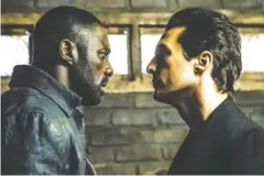  ?? ILZA KITSHOFF/COLUMBIA PICTURES ?? Roland (Idris Elba, left) and Walter (Matthew McConaughe­y) in “The Dark Tower.”