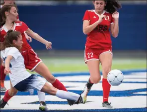  ?? NWA Democrat-Gazette/CHARLIE KAIJO ?? Springdale Har-Ber’s Erika Orelanna-Aguilar (left) kicks the game-winning goal past two Fort Smith Northside defenders Thursday, giving the Wildcats a 2-1 victory in the Class 7A girls soccer state tournament at Whitey Smith Stadium in Rogers.