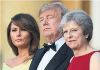  ?? GEOFF PUGH/AFP/GETTY IMAGES ?? Details from U.S. President Trump’s interview became public as he attended a black-tie dinner with British PM Theresa May.