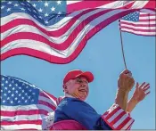  ?? DOUGAL BROWNLIE / THE (COLORADO SPRINGS) GAZETTE ?? Daryl Richmond of Monument, Colo., waves to the crowd Tuesday during Monument’s Fourth of July parade.