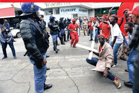  ??  ?? CROSS PURPOSES: Followers of the EFF protest outside the Greenhills Stadium during the State of the Province Address in Randfontei­n. PICTURES: ITUMELENG ENGLISH