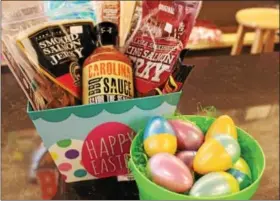  ?? MICHILEA PATTERSON — DIGITAL FIRST MEDIA ?? Barbecue sauce and smoked salmon jerky products make healthy additions to Easter baskets for adults.