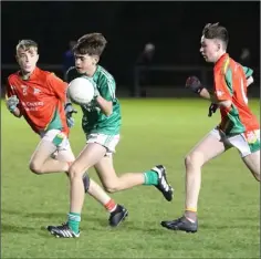  ??  ?? Tom Funge under pressure from Evan Horan and Conor O’Brien.